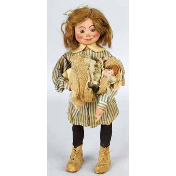 Wind-Up Mechanical Composition Head Doll.: Blonde girl with glass eyes. Wearing blue and white striped outfit and holding a small bisque head baby. Missing three fingers and is over wound. 14" T.