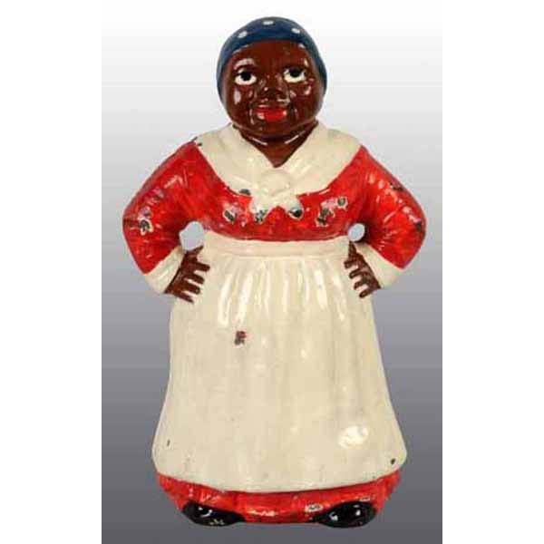 Small Cast Iron Mammy Doorstop.: Made by Hubley, cat. #486. Full figure, classic pose with hands on hips. 9 - 1/2" T.