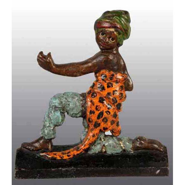 Cast Iron Jungle Boy Doorstop.: Depicts jungle boy in kneeling position wrapped in leopard skin. Superb casting and size. 12 - 5/8" x 11 - 7/8".