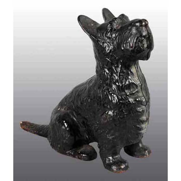 Cast Iron Sitting Scottie Doorstop.: Full figure. Great detail in casting of hair. 7 - 3/4" x 8 - 1/2".