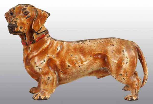 Cast Iron Dachshund Doorstop.: Made by Hubley, cat. #326. Marked "Made in USA". Tan paint variation. 6 - 1/4" x 9 - 1/2".