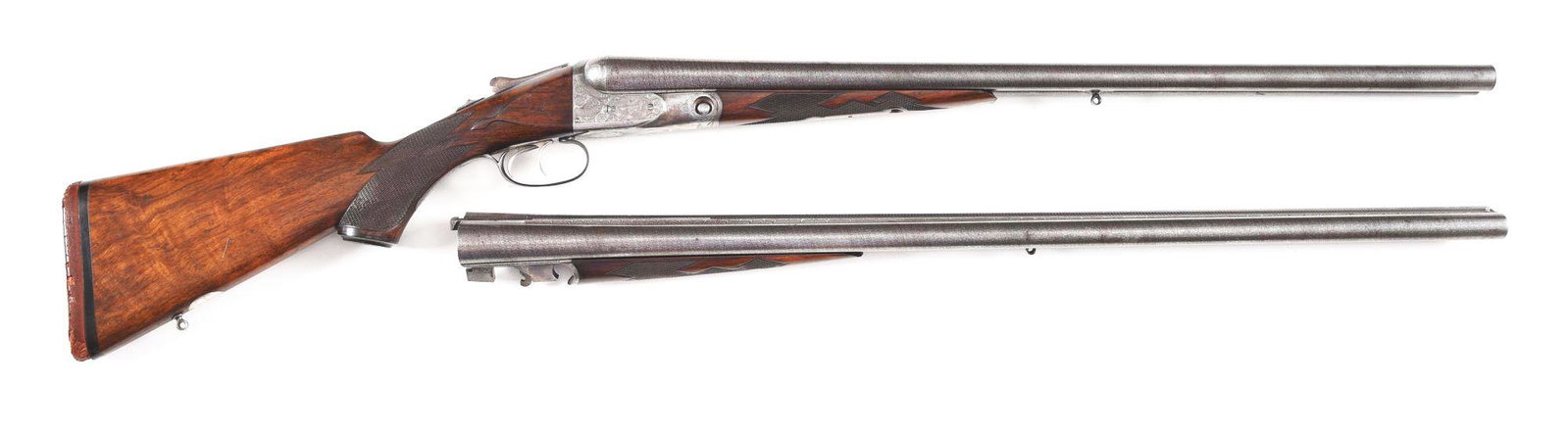 (C) PARKER DHE SIDE BY SIDE SHOTGUN WITH EXTRA BARREL: Parker DHE Grade side by side shotgun with rare extra set of matching barrels and several other special order features made by the Parker Gun Company in 1905. Factory letter states several rare factor