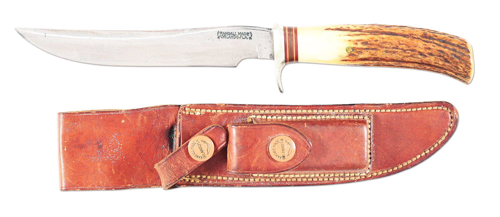 EARLY RANDALL FIXED BLADE WITH ORIGINAL SHEATH.: RANDALL MADE ORLANDO, FLA. Tang stamped surrounded by two swords. Early fixed blade 6 - 1/4" saber ground clip point blade; overall 11". Handled in stag horn with a heavy nickel silver finger guard. O