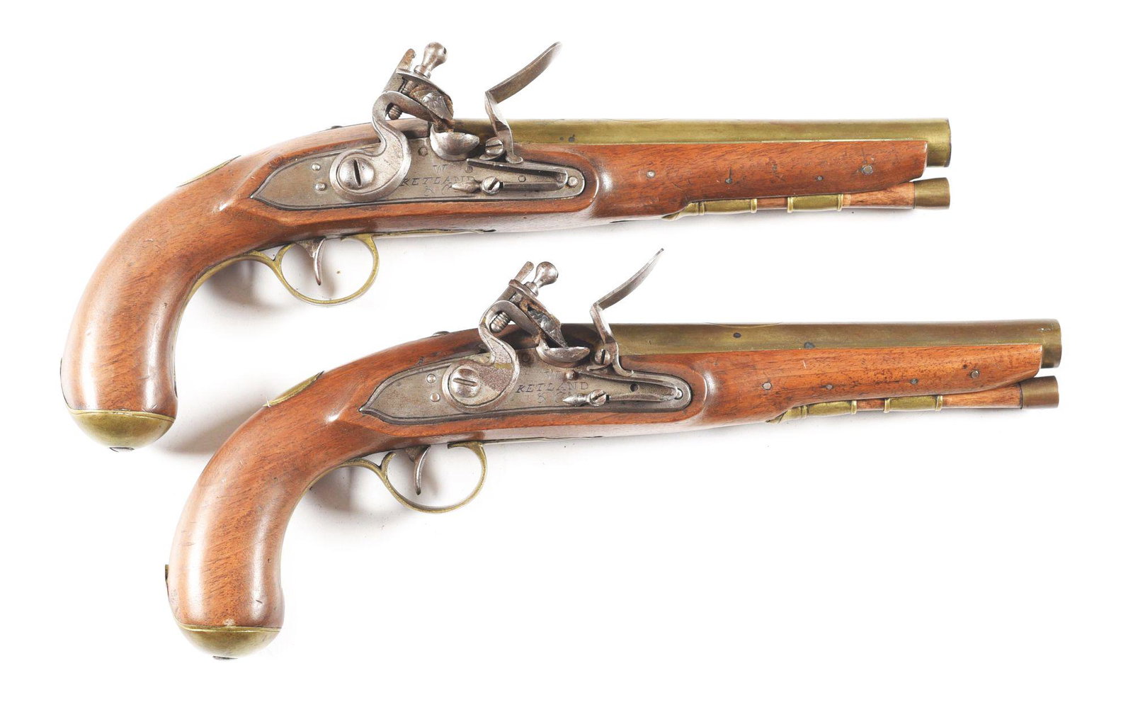 (A) PAIR OF BELGIAN FLINTLOCK PISTOLS MARKED KETLAND: Both circa 1810-1820. The quality of English pistols in the 19th century was well known and they were highly sought after. These pistols are Belgian made copies of Ketland & Company flintlock pistols,