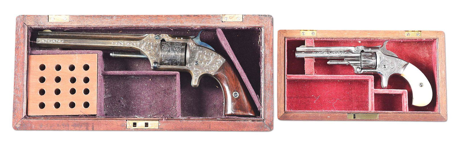 (A) LOT OF TWO: SMITH AND WESSON NO. 1 AND NO. 2: Lot consists of (A) S&W No. 2 revolver with half moon front sight, notch rear sight. Fire blued small parts. Smooth walnut grips. Frame, cylinder, and barrel have been contemporarily engraved by W.B.