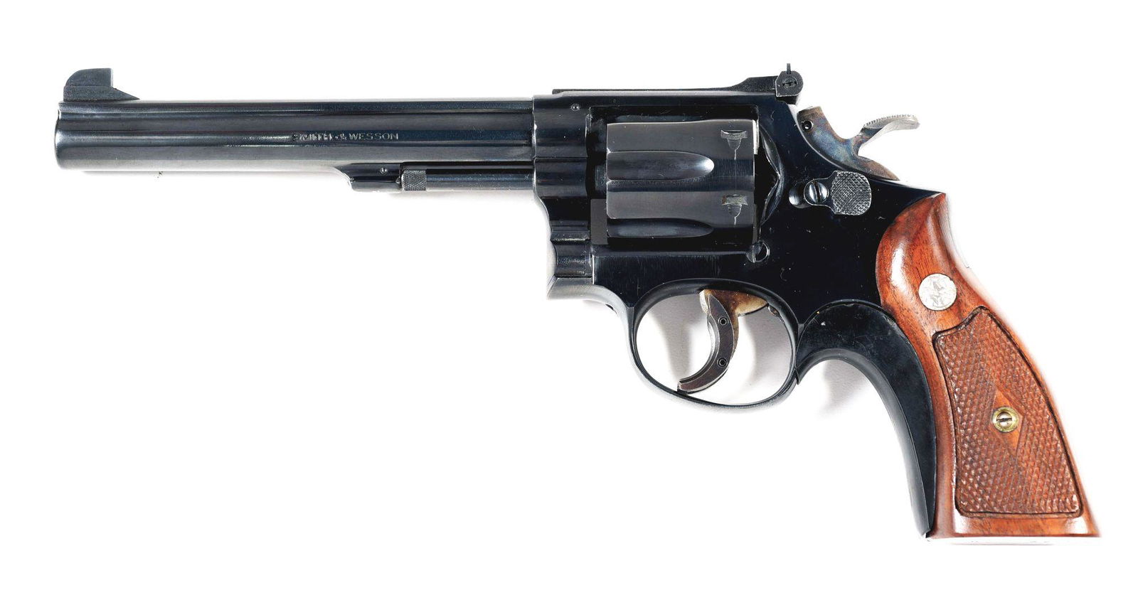 (C) SMITH & WESSON K38 TARGET MASTERPIECE DOUBLE ACTION: Referred to as the Pre-Model 14 with 6" barrel with serrated full length sighting rib leading to a fixed smooth front sight and adjustable square notch rear sight. Pinned barrel. Partial lug. Wide cas