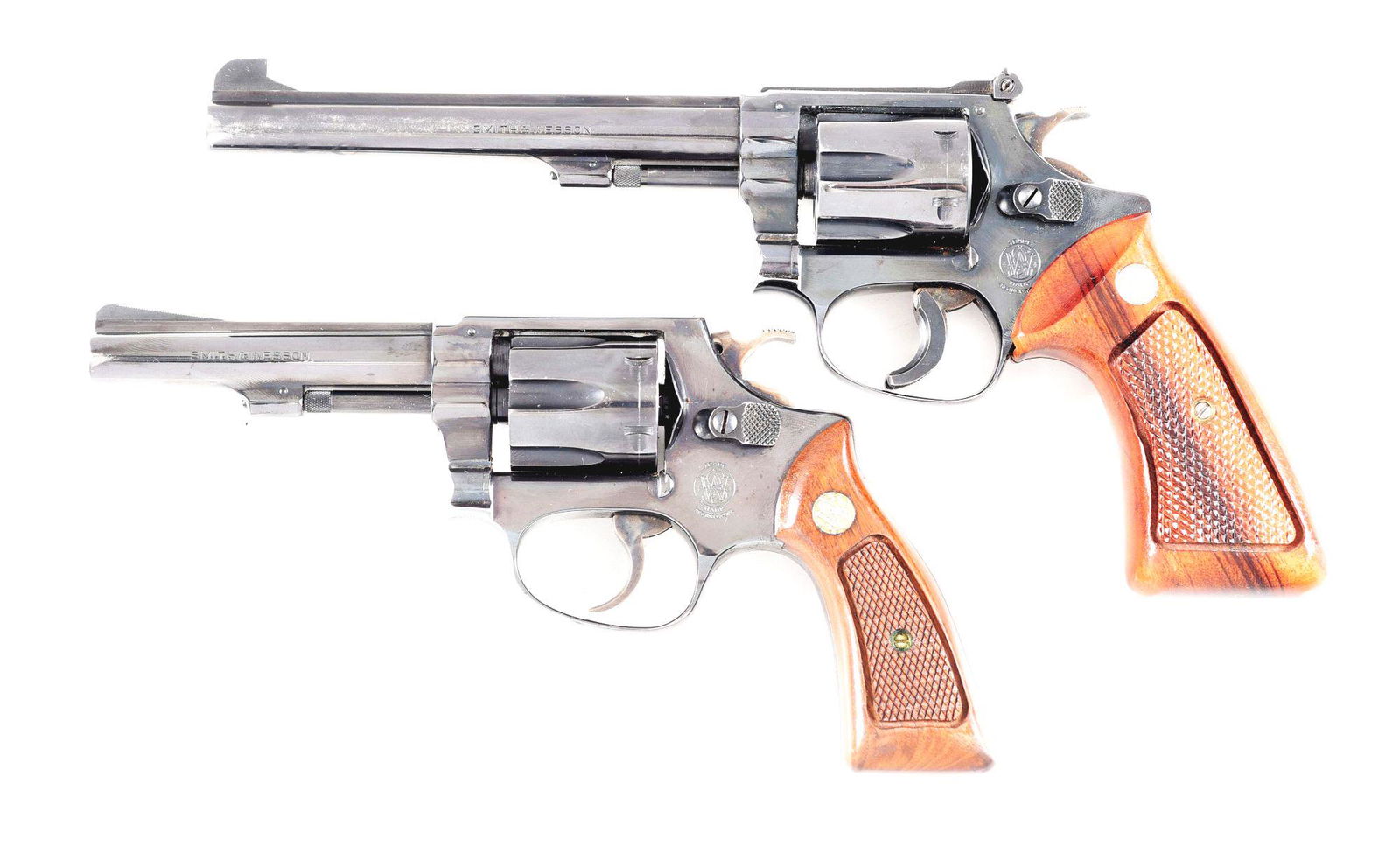 (M) LOT OF 2: SMITH & WESSON MODEL 35-1 AND MODEL 31-1: Lot consists of (A) Smith & Wesson Model 35-1 double action revolver. Made 1971-1973. Company trademark on the left side of the frame, with the address on the right side of the frame. Round butt frame