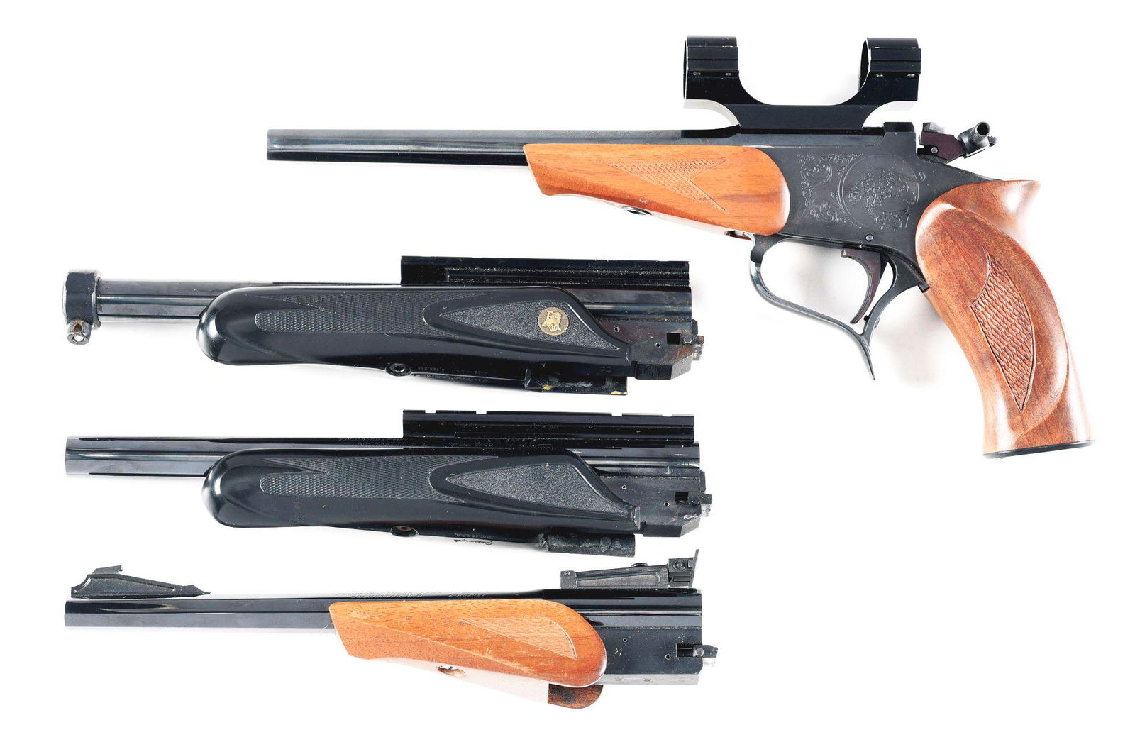 (M) THOMPSON CENTER CONTENDER SINGLE SHOT PISTOL WITH 3: Thompson Center Contender single shot pistol with 3 barrels. Made 1988. Right side of the barrel is marked "THOMPSON : CENTER ARMS / ROCHESTER, N H. 22 LR". Octagon barrel with a gloss blued finish. N