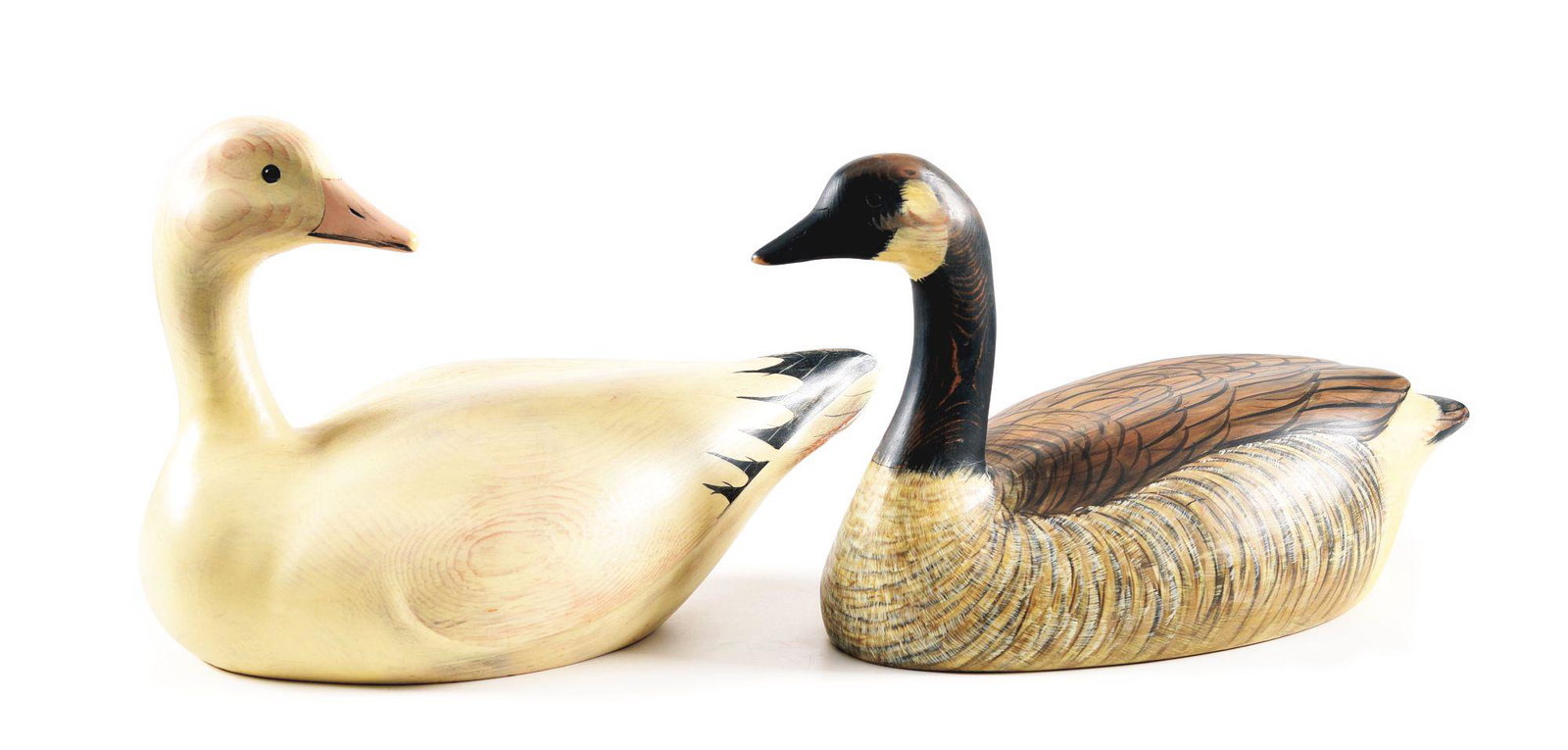 LOT OF 2: LIFE SIZED GOOSE DECOYS BY RD WILSON OF: Lot consists of: (A) Lesser snow goose wooden decoy, hand carved and painted by RD Wilson of Little Rock, Arkansas. RD Wilson has been hand carving and painting wooden hunting decoys for over 35 years