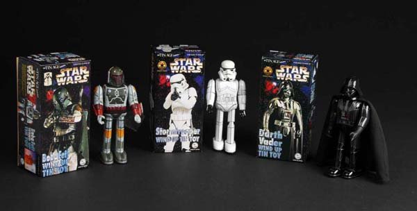 Lot of 3: Tin Star Wars Wind-Up Toys.: Description Japanese. Made by Osaka Toy Institute. Includes Darth Vader, Storm Trooper missing rifle, and Boba Feit. Includes three original boxes. Condition (Near Mint). Size All: 10" T.