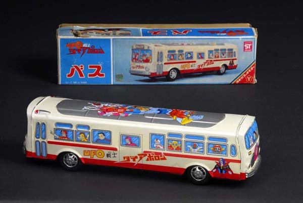 Diapalon UFO Bus Toy.: Description Japanese. Made by Yonesowa. Working. Propelled by friction mechanism. Includes original box with side apron tear and overall wear. Toy (Near Mint - Mint) Box (Excellent). Size 15" L.