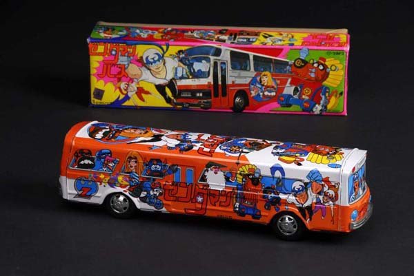Superhero in Bus Toy.: Description Japanese. Made by TT. Working. When in operation, toy travels with friction motor. Includes original box. Condition (Near Mint). Size 15" L.
