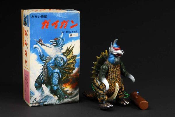 Tin & Vinyl Giag Toy.: Description Japanese. Made by Bullmark. Working. When in operation, toy walks forward while arms move up and down and screeching sound is emitted. Includes original box and inserts with some slight cr