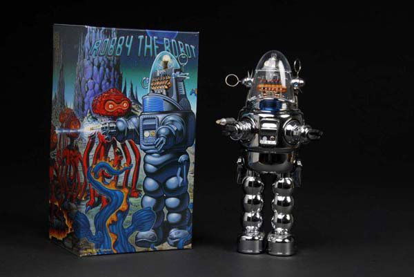 Contemporary Roby the Robot Toy.: Description Japanese. Made by Osaka. Metallic silver version. Working. When in operation, toy walks forward with illuminated light while space sound is emitted. Condition (Unused). Size 12 - 1/2" T.