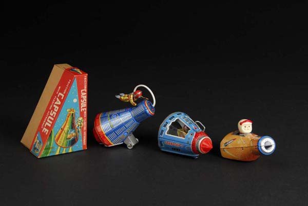 Lot of 3: Space Capsule Toys.: Description Japanese. Includes one Friendship 7, one with astronaut pilot, and one capsule with floating astronaut. Includes one original box with puncture on front. Condition (Very Good - Excellent).