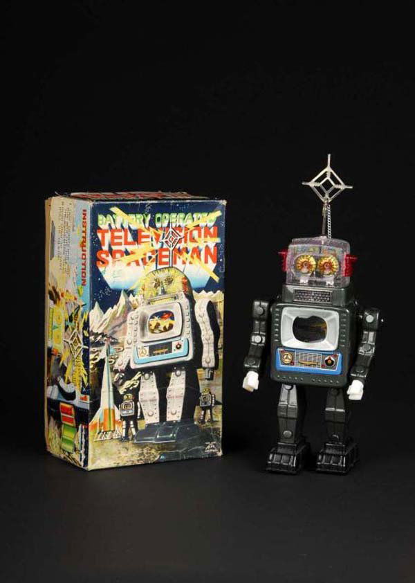 Tin Television Space Man.: Description Japanese. Made by Alps. Plastic battery pack door variation. Robot illuminates but does not work. When in operation, battery-operated robot walks forward while swining plastic arms back an