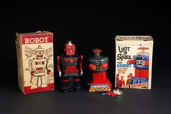 Lot of 2: Lost in Space & Electric Robot Toys.: Description Plastic. Both are not working. Lost in Space toy with original hands and battery bar but top of dome has been split apart and needs to be put back together. Includes two original boxes wit
