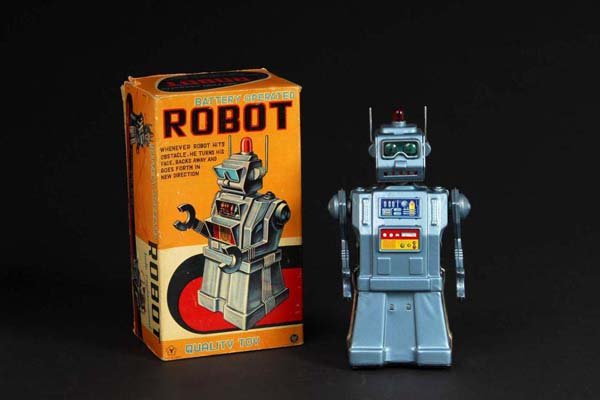 Tin Directional Robot.5: Description Japanese. Made by Yonesowa. When in operation, battery-operated robot moves forward as the headlamp and eyes illuminate. As the robot travels, the head turns in the direction that he is mo
