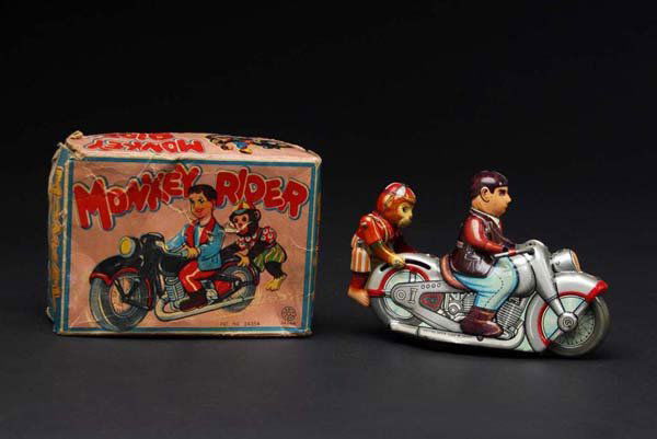 Tin Monkey Rider Motorcycle Wind-Up Toy.: Description Japanese. Working. When wound, monkey on back goes up and down while the cycle rolls forward. Beautiful lithography with some moderate overall wear and scratching. Includes complete origin
