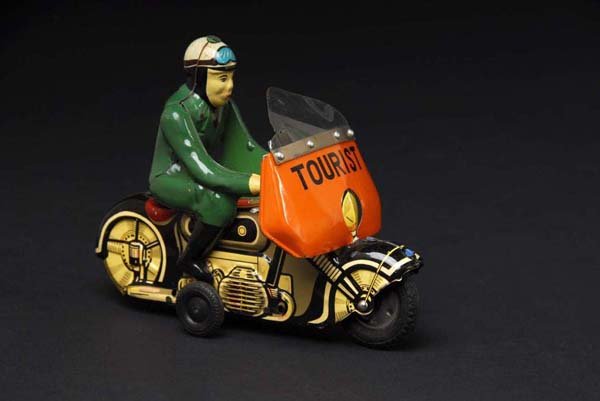 Tin Tourist Motorcycle Friction Toy.: Description Japanese. Working. Original plastic windshield has one half-inch split on left corner and cycle has minor wear overall. Condition (Very Good - Excellent). Size 6 - 1/2" L.