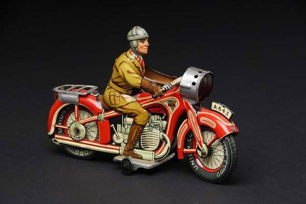 Tin Arnold Motorcycle Wind-Up Toy.: Description German. Working. Marked "Made in US Zone Germany" and "A643" on front license plate. Original front headlight. Some minor to moderate wear. Condition (Very Good - Excellent). Size 8" L.