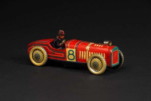 Tin No. 8 Race Car Wind-Up Toy.: Description Japanese. Pre-war. Working. Marked "Made in Japan" on right side and number "8" on both sides. Beautiful, early lithography. Original driver. Some minor scratching and wear, especially to 