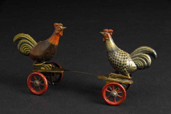 Tin Rooster Fighting Wind-Up Toy.: Description German. Working. Marked "Germany" on both roosters. Beautiful lithography with some scratching and wear throughout. Condition (Very Good). Size 10" L.