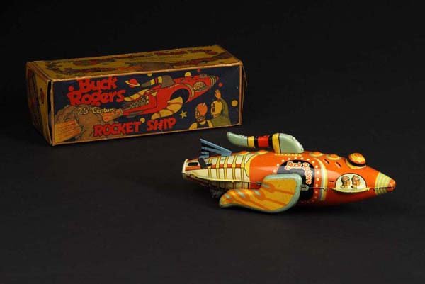 Tin Marx Buck Rogers Rocket Ship Wind-Up Toy.: Description American. Working but needs flint to spark. Original tail fin. Some fading, one moderate scuff on bottom of toy by Buck Rogers, and light rubbing to the back and top tail fins. Includes or