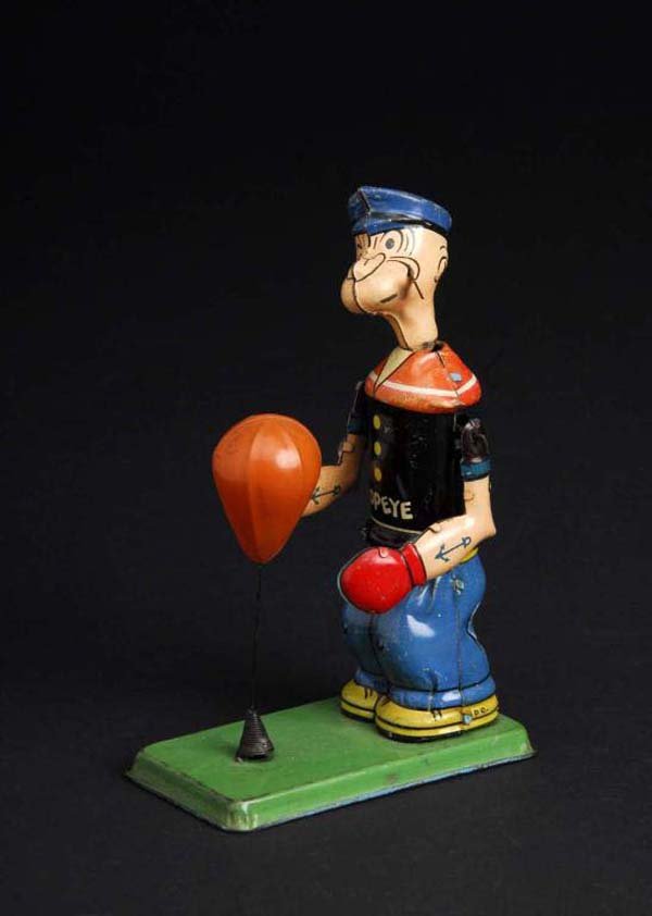 Tin Chein Popeye Floor Puncher Wind-Up Toy.: Description American. Working. Original pipe and bag. One small scuff on Popeye's chin, some slight scratching throughout Popeye figure, and scratching on edge of base. Condition (Very Good). Size 8" 