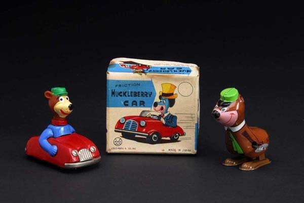 Lot of 2: Tin Yogi Bear Toys.: Description Both are working. Marked "Hanna-Barbera Productions" on both. Includes one wind-up hopper and one friction car with vinyl head. Includes one original box for friction car with some creasin