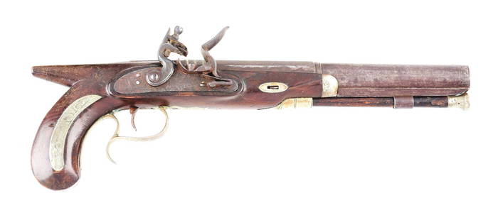 (A) AMERICAN SILVER MOUNTED SAW HANDLE FLINTLOCK: See previous lot for a nearly identical example. Henry T. Cooper worked in New York in the early to mid 19th Century. This pistol has a fine two stage barrel with elaborate stiff leaf engraving and