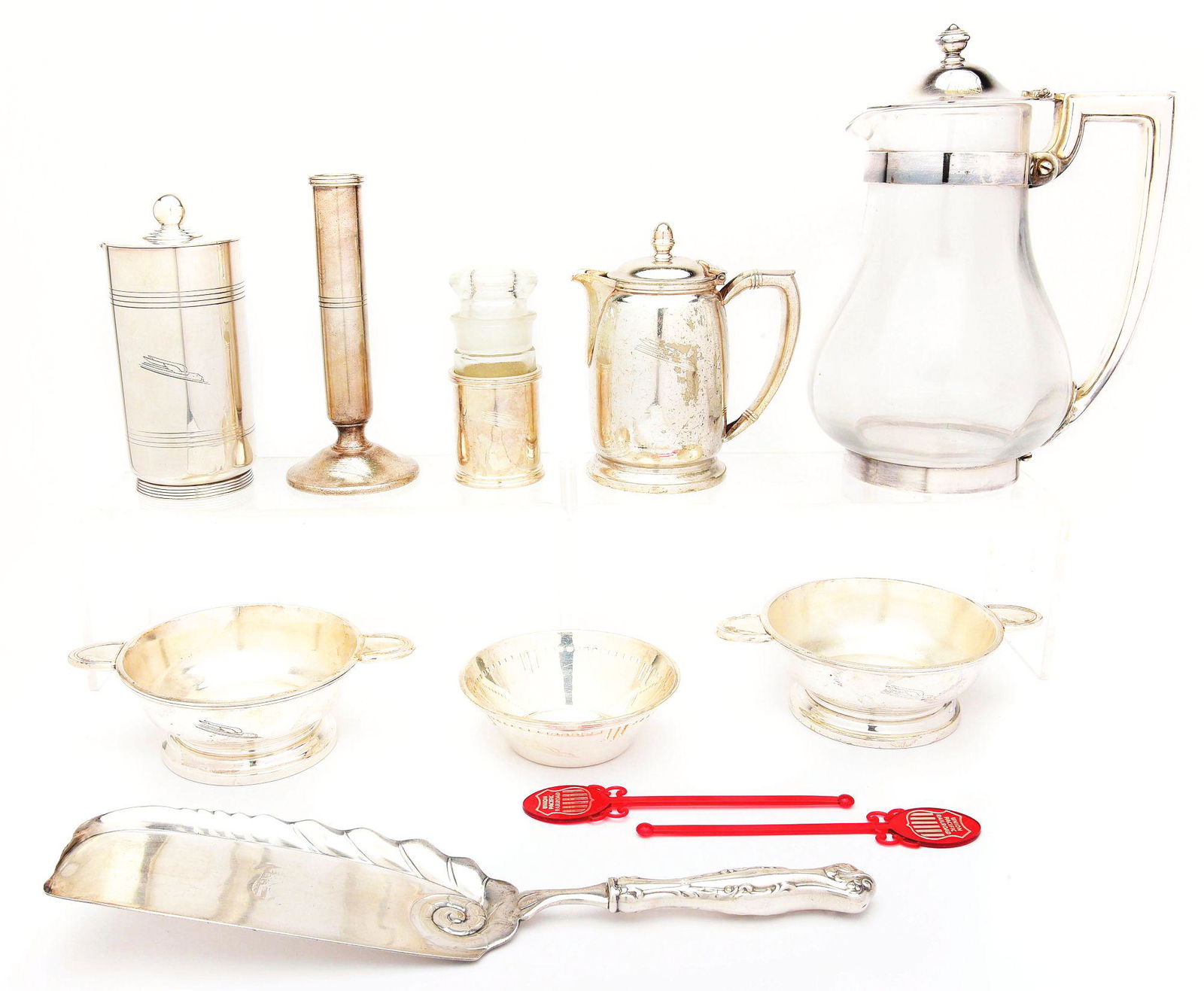 LOT OF UNION PACIFIC SILVER ITEMS.: Lot includes: first, two plastic drink swizzlers; second, a Crumber with "Union Pacific Overland Route logo" stamped in center; third, an IS glass and silver liquid container with tapered stopper, dam