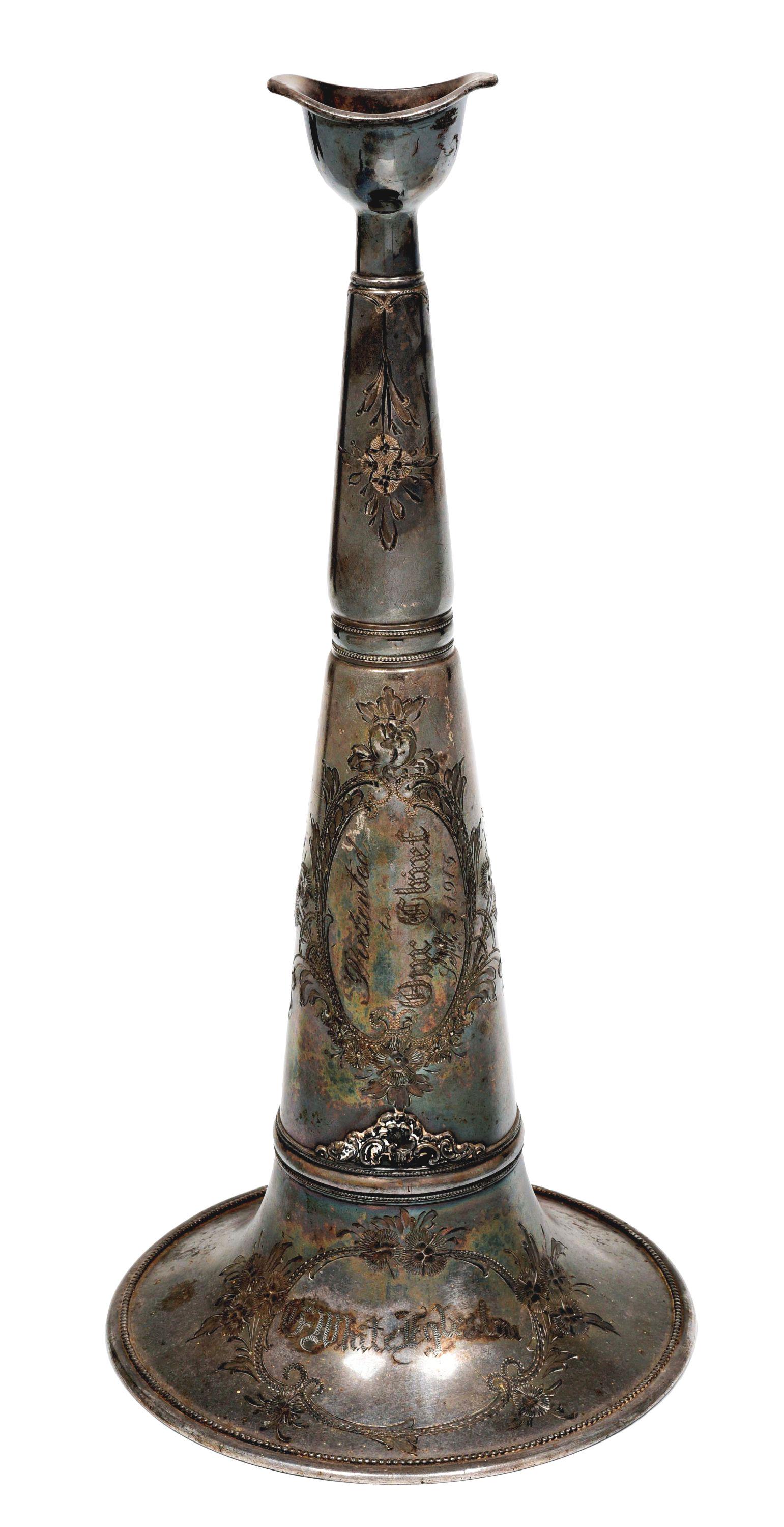 PEWTER PARADE TRUMPET.: Ornately decorated parade trumpet. Inscription engraved says "Presented to Our Chief, September 3rd, 1915". Engraved "G. White, Egleston" on trumpet bell. Beaded and floral decorations, medium tarnish