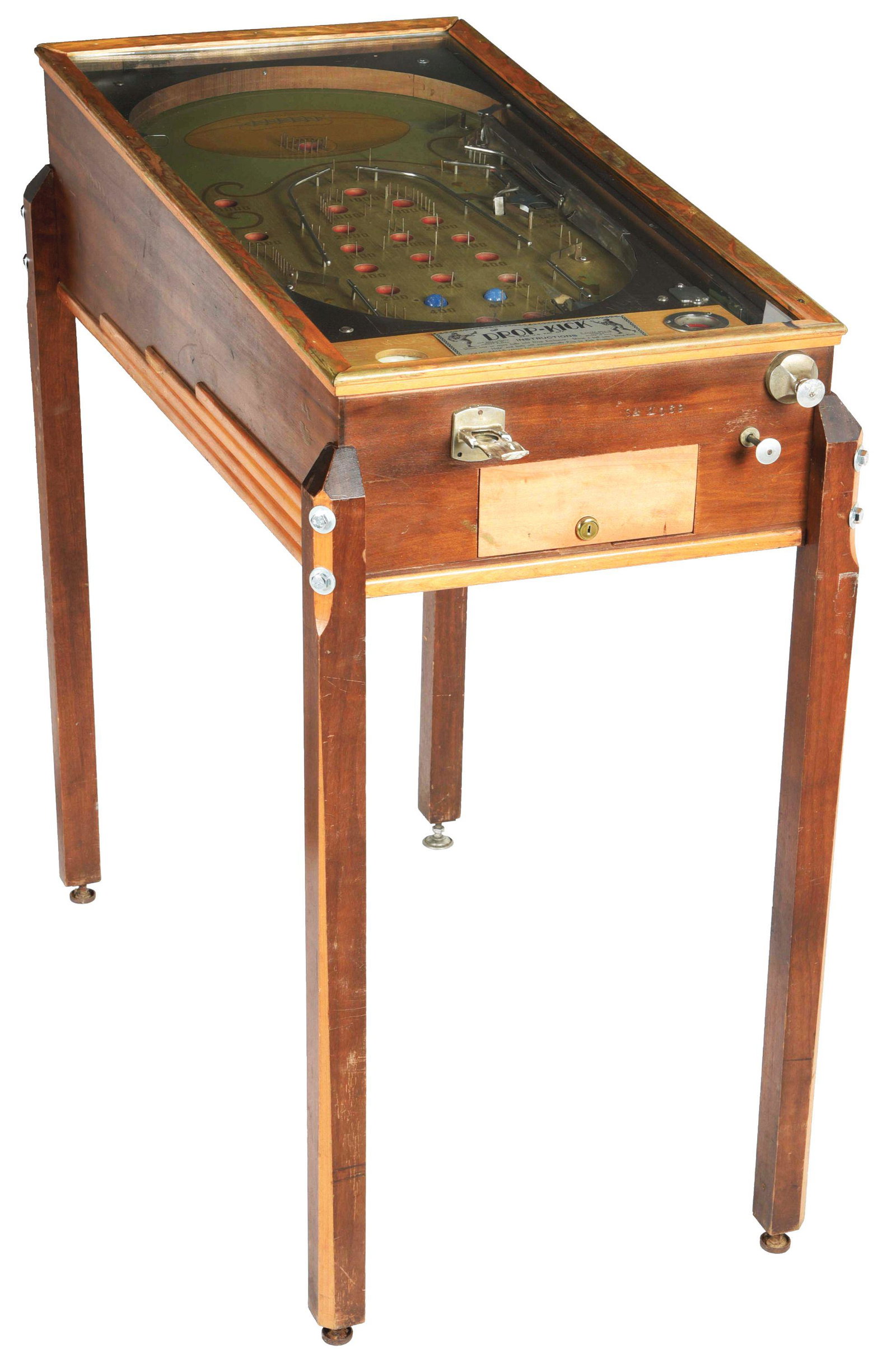 DROP-KICK FOOTBALL THEME WOOD RAIL PINBALL MACHINE.: This is a rare wood rail pinball machine with a football theme labeled "Drop Kick". Great graphics, with wear to the cabinet, new bolts in the legs, wear to the play field, and a replaced cash door. W