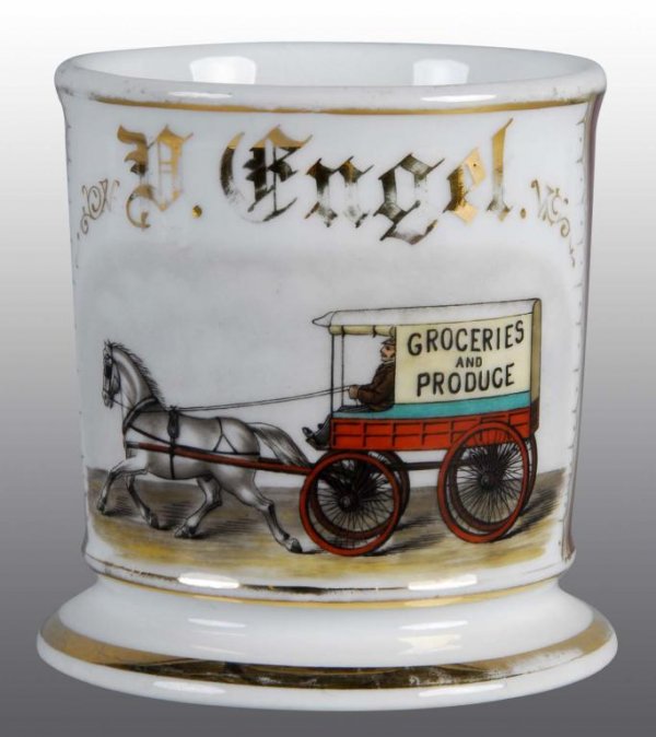Occupational Shaving Barber Mug of Grocery Wagon.: Description Polychrome paint. Name D. Engel Gilt across front. Nice depcition of a horse drawn grocery and produce wagon. Condition (Excellent). Size 4" T.