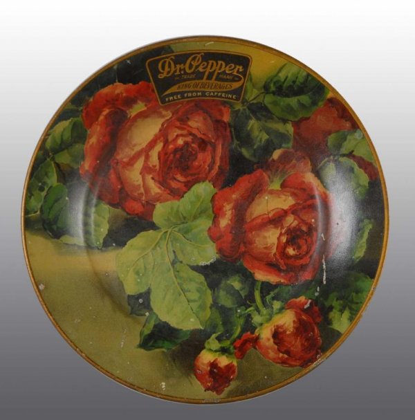 Tin Litho Dr. Pepper Tray.: Description Circa 1905. Features roses. Some small to medium scratches. Light wear and overall crazing. Minor marks. Condition (7.5, Good). Size 10" Dia.
