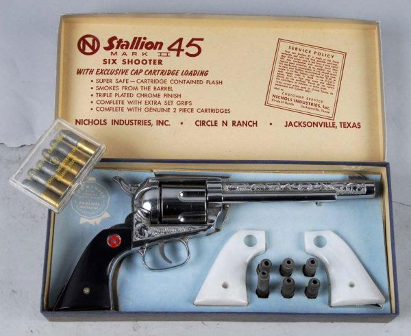 Nichols Stallion 38 Cap Gun.: Description Includes box and extra bullets. Toy (Near Mint) Box (Excellent). Size 12" L.