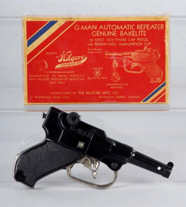 Cast Iron Kilgore G-Man Cap Gun.: Description Has the cast iron trigger guard, trigger and the clip that can be ejected. Includes box. Toy (Near Mint Plus) Box (Very Good). Size 6" L.