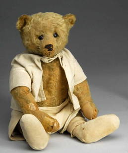 Early Steiff Mohair Bear.: Description Germany, Ca. 1910. Steiff metal button in ear. Fully jointed bear with shoebutton eyes, shaved snout, sewn nose (stitches missing), nice hump, long arms, big feet, felt paw pads (wear on