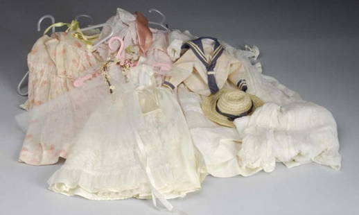 Lot of Vintage Doll Clothing.: Description Satin bride dress, cotton print dress, newer sailor dress with hat, lovely pink cotton dress with ruffles and lace trim, white cotton dress, white baby christening dress, lovely child's