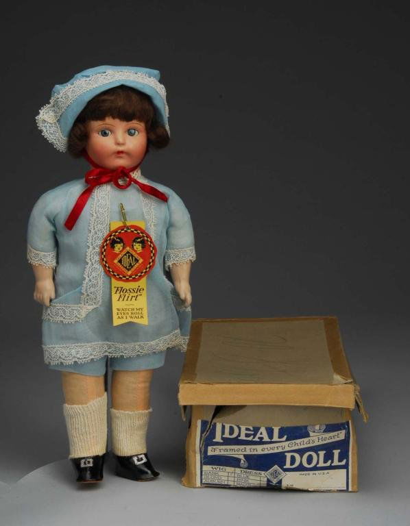 Ideal Flossy Flirt in Original Box.: Description American, Ca. 1925. Ideal mark on head, composition head and arms, cloth body and legs. Flirty eyes function well, original mohair wig. Totally factory original dress, hat, undie, shoes an