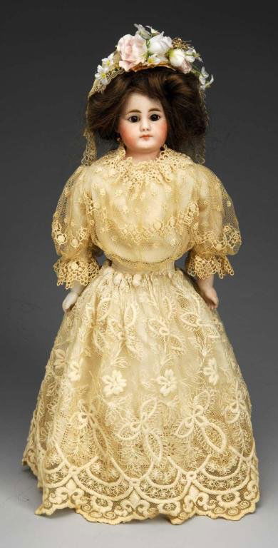Simon & Halbig 950 Lady Doll.: Description Germany, Ca. 1880s. Bisque shoulder head incised S 7 H 950 (a few wig pulls on back, speckling on cheek), made by Simon & Halbig, flat painted eyebrows, dark stationary eyes, closed mouth,