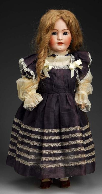 Franz Schmidt Child Doll.: Description Germany, Ca. 1900. Bisque socket head incised S & C Made in Germany. Molded eyebrows, inset stationary glass eyes (no sleep), open mouth with tongue and teeth, replaced human hair wig. Joi