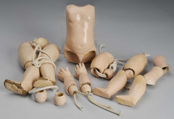 Antique E.J. Jumeau French Body.: Description Composition and wood body for an E.J. Jumeau with separate ball joints, straight wrists (some repainting and needs additional repair), together with an extra set of EJ legs with ball joint
