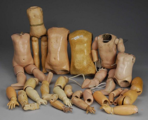 Lot of Antique German & French Bodies & Parts.: Description 18" K & R body (needs lots of work, no hands), early Jumeau torso, 17" Jumeau torso and legs, 15" French walking body plus lots of other torsos and limbs. Mixed condition. Not all pictured