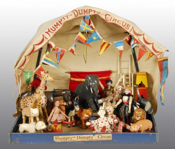 Schoenhut Humpty Dumpty Circus Tent.: Description American, 1903 to 1935. With animals and accessories. 13 small-size animals include two white horses without saddles, giraffe, hippo, pig, lion, two tigers, poodle dog, two donkeys, double