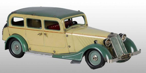 Tin Marklin Automobile Wind-Up Toy.: Description German. Circa 1920s to 1930s. Working. Built from a kit with screws fastening the tin together. Some minor scratching to roof and front left fender. Condition (Excellent). Size 15" L.