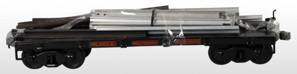 Pressed Steel Buddy L Railroad Flat Car Toy.: Description T Reproduction. New old stock. Includes a load of assorted metal. Size 21" L.