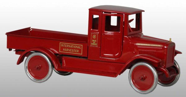 Pressed Steel Buddy L Red Baby Toy.: Description American. Circa 1932. T reproduction. New old stock. Includes the original shipping box. Size 24" L.