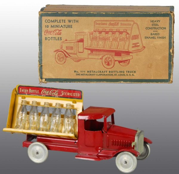Pressed Steel Metalcraft Coca-Cola Truck Toy.: Description American. Non-rubber tires with ten glass Coca-Cola bottles. Decals on both sides of rear. Some oxidation to grille and minor scratching throughout. Includes original box with missing end 